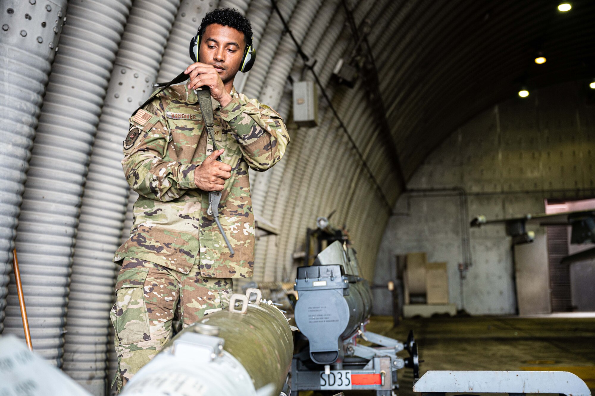 U.S. Air Force Staff Sgt. Malik Van Diver, 36th Fighter Generation Squadron weapons load crew chief, prepares to use a load binder at Osan Air Base, Republic of Korea, July 30, 2024. Van Diver and his teammates are constantly learning and growing, no matter the rank of an individual. Their dedication to craft directly impacts the readiness of 51st Fighter Wing Airmen and their ability to carry out the “Fight Tonight” mission. (U.S. Air Force photo by Staff Sgt. Christopher Tam)