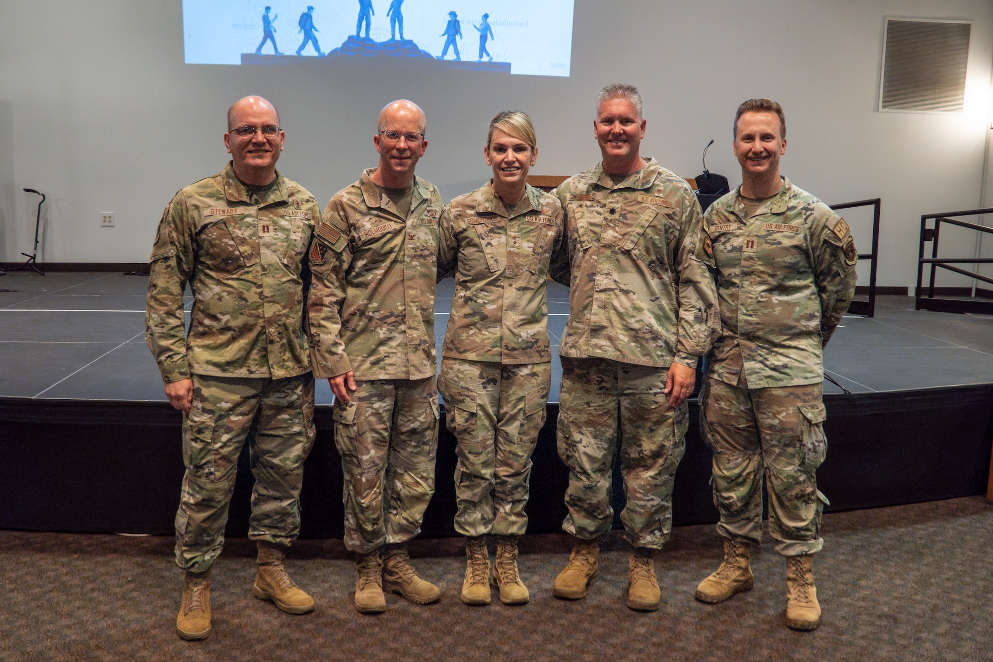 Five Airmen stand together