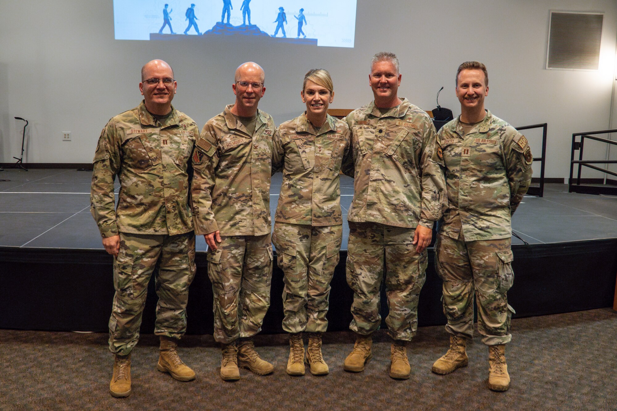Five Airmen stand together