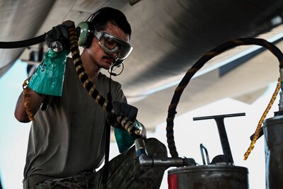 U.S. Air Force Staff Sgt. Jacob Szatkowski, 28th Maintenance Group dedicated crew chief, runs the auxiliary power unit of a B-1B Lancer to perform a refuel during Red Flag 24-3 at Nellis Air Force Base, Nev., July 25, 2024. Red Flag is an opportunity to enhance the readiness and training necessary to respond as a joint force to any potential crisis or challenge across the globe. (U.S. Air Force Photo by Senior Airman Yendi Borjas)