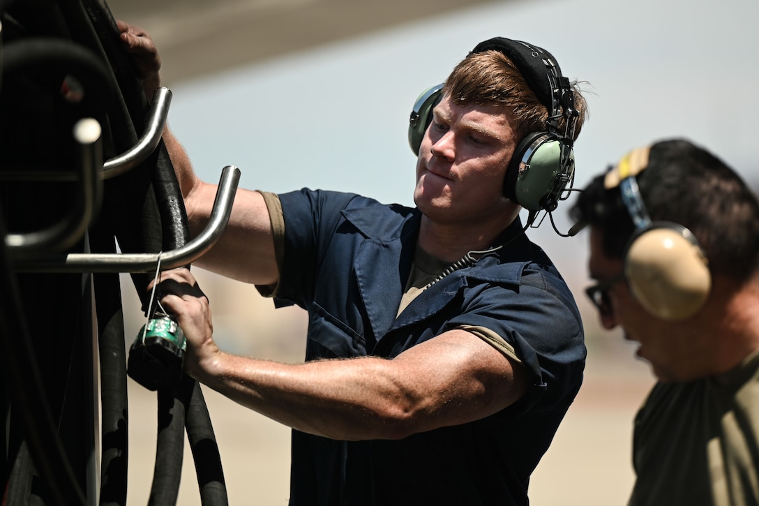 U.S. Air Force Airman 1st Class Masen Riser, 28th Maintenance Group crew chief, wraps up a hydro mule during Red Flag 24-3 at Nellis Air Force Base, Nev., July 24, 2024. Red Flag trains Airmen and Guardians on strategy, force design and adversary warfighting for the purpose of building a force that will reduce Air Force vulnerabilities, capitalize on strengths, and exploit adversaries’ weaknesses. (U.S. Air Force Photo by Senior Airman Yendi Borjas)