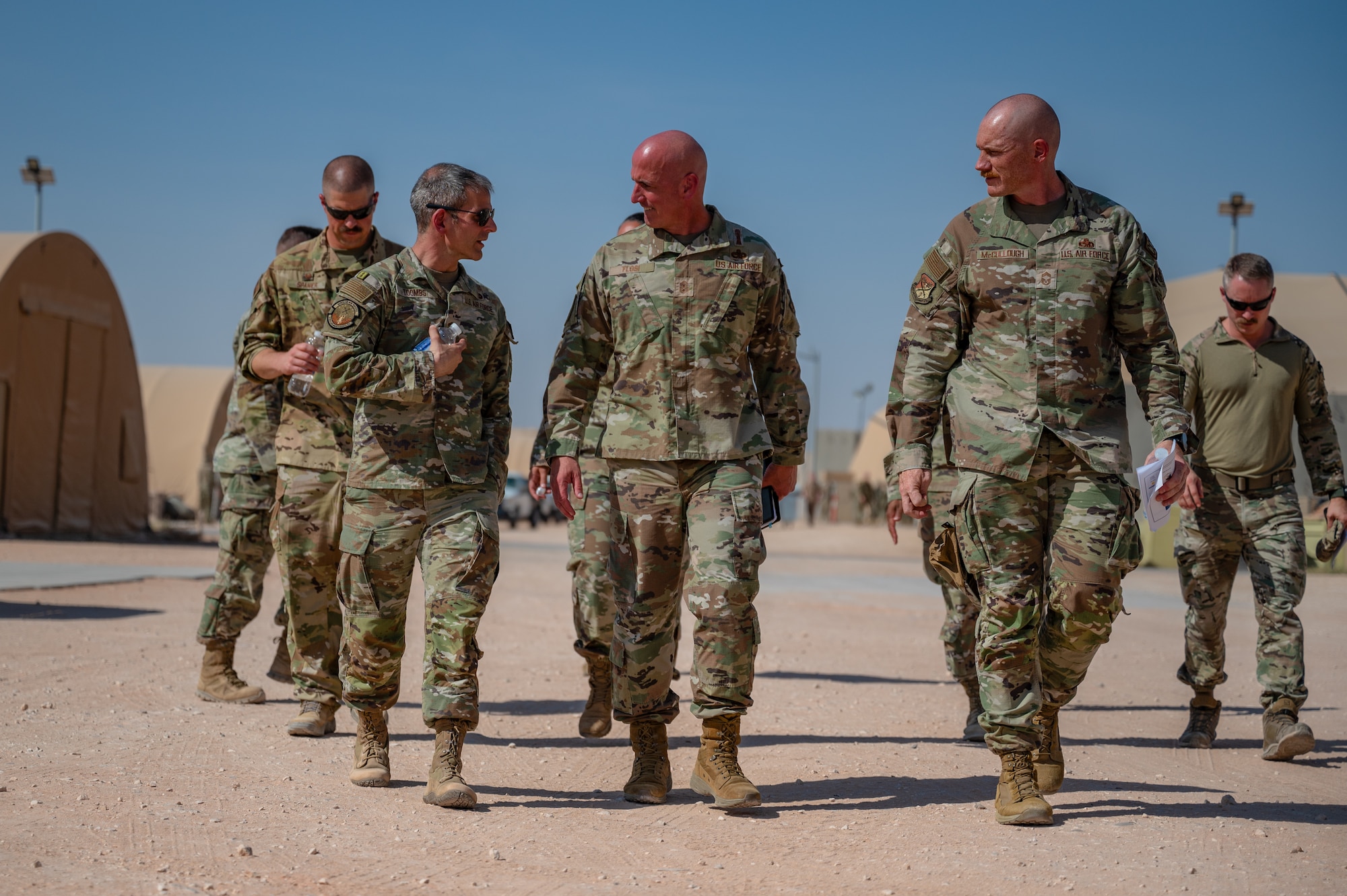 Chief Master Sgt. of the Air Force David Flosi walks alongside 378th Air Expeditionary Wing leadership at an undisclosed location within the U.S. Central Command area of responsibility, July 23, 2024. During his historic first visit, Flosi spoke about the significance of further developing Airmen alongside the new Air Task Force model to increase overall mission readiness. (U.S. Air Force photo)
