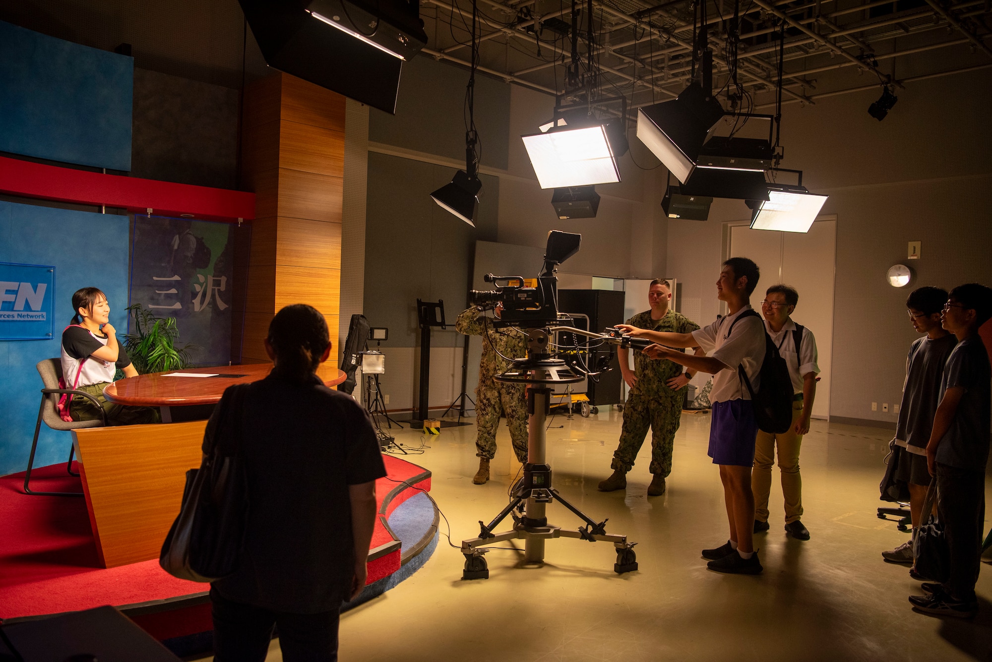 Students from Oirase Middle School learn about the American Forces Network television studio during a Junior English tour at Misawa Air Base, Japan, July 30, 2024.