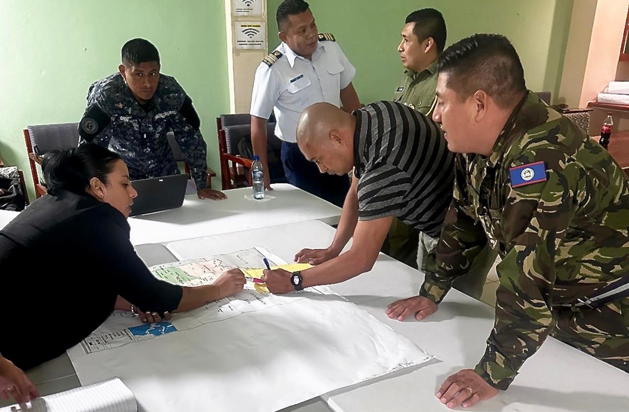 A photo of people looking at a map.