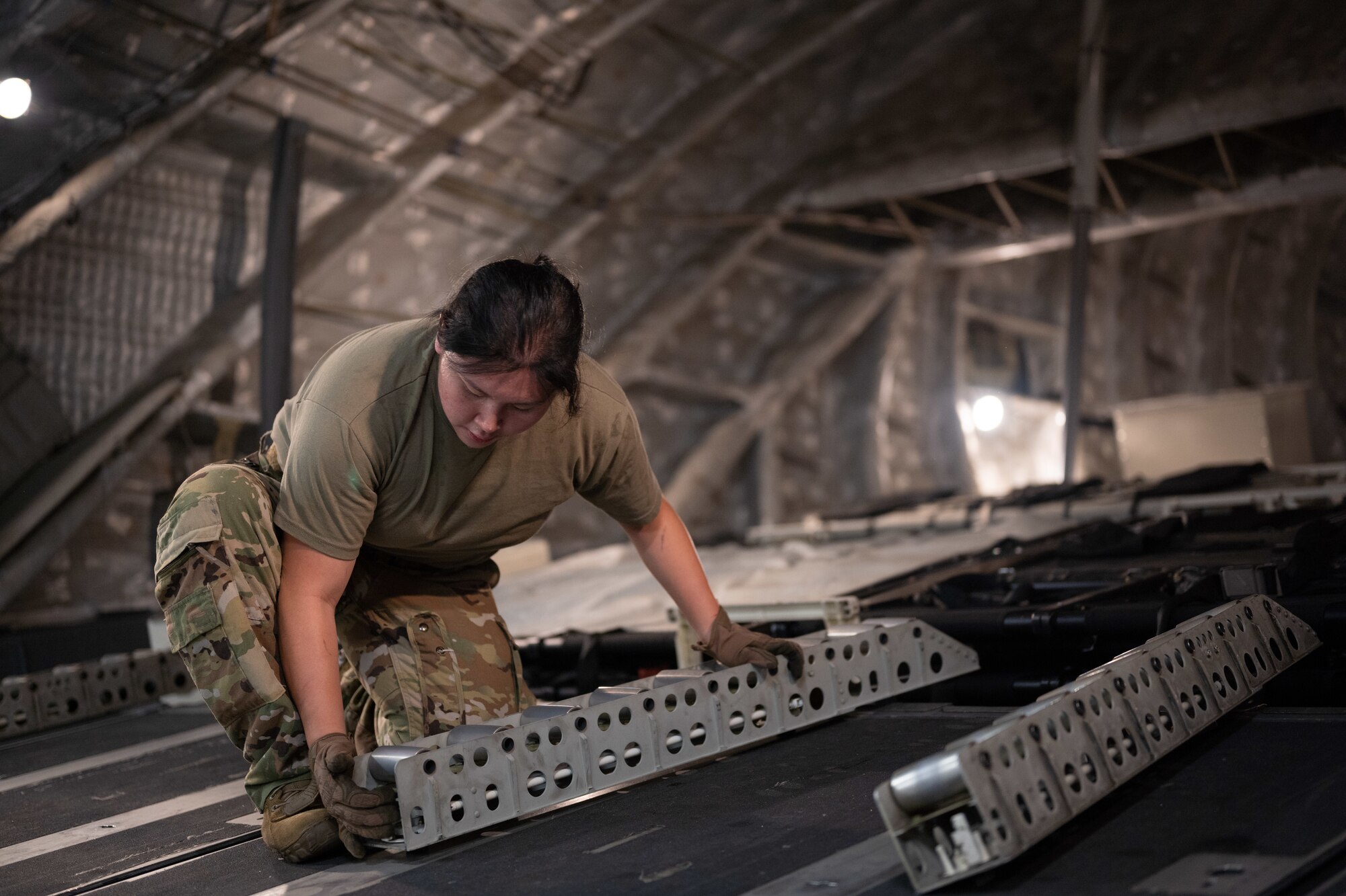 Airmen preparing rollers in aircraft