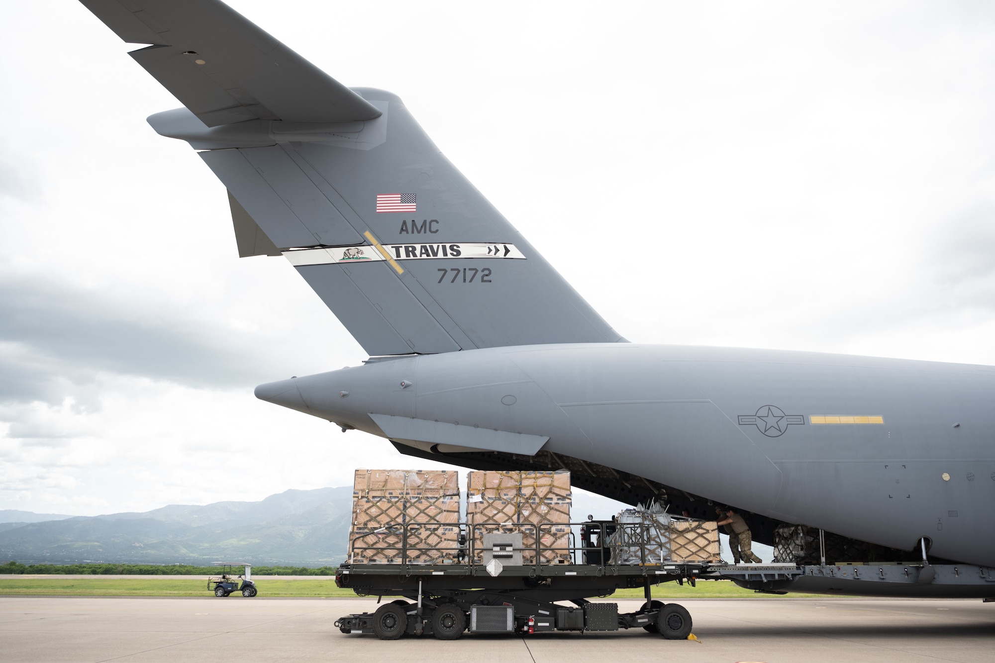 Airmen unloads cargo from an aircraft