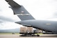 Airmen unloads cargo from an aircraft