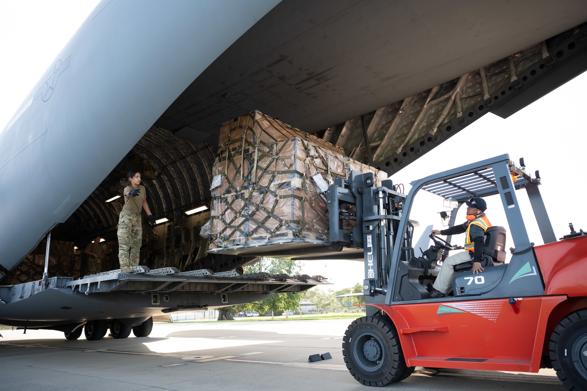 Airman unloads cargo from aircraft