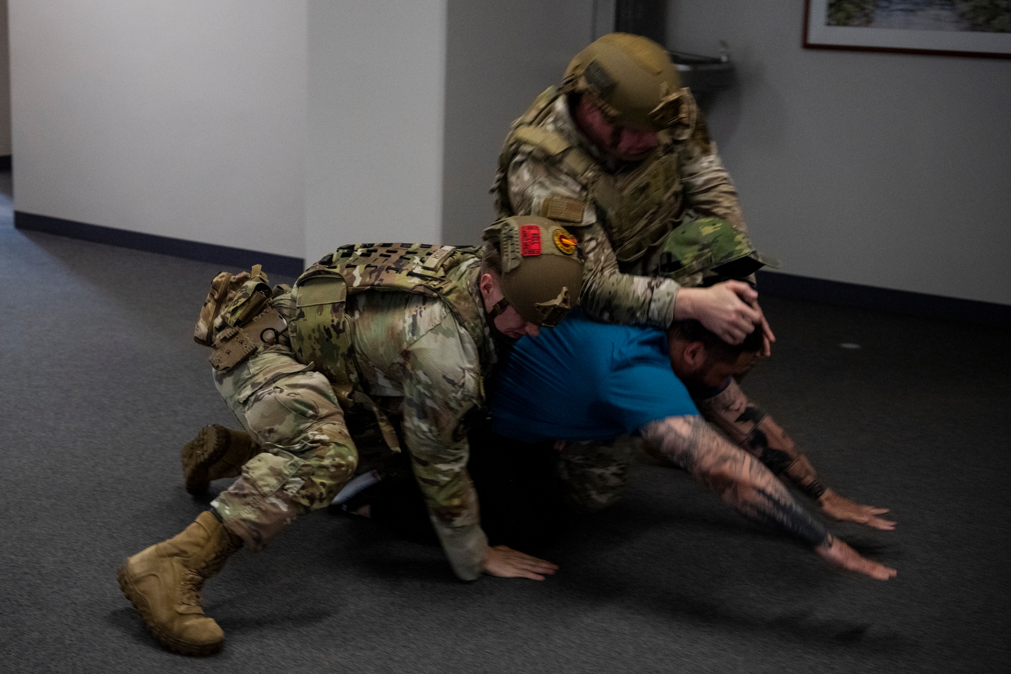 U.S. Airmen with the 35th Security Forces Squadron apprehend an assailant actor during an active shooter exercise at Misawa Air Base, Japan, Aug. 1, 2024.