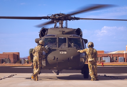 U.S. Army Soldiers from the Arizona National Guard conduct pre-flight checks before take off, August 1, 2024 in Phoenix, Arizona.