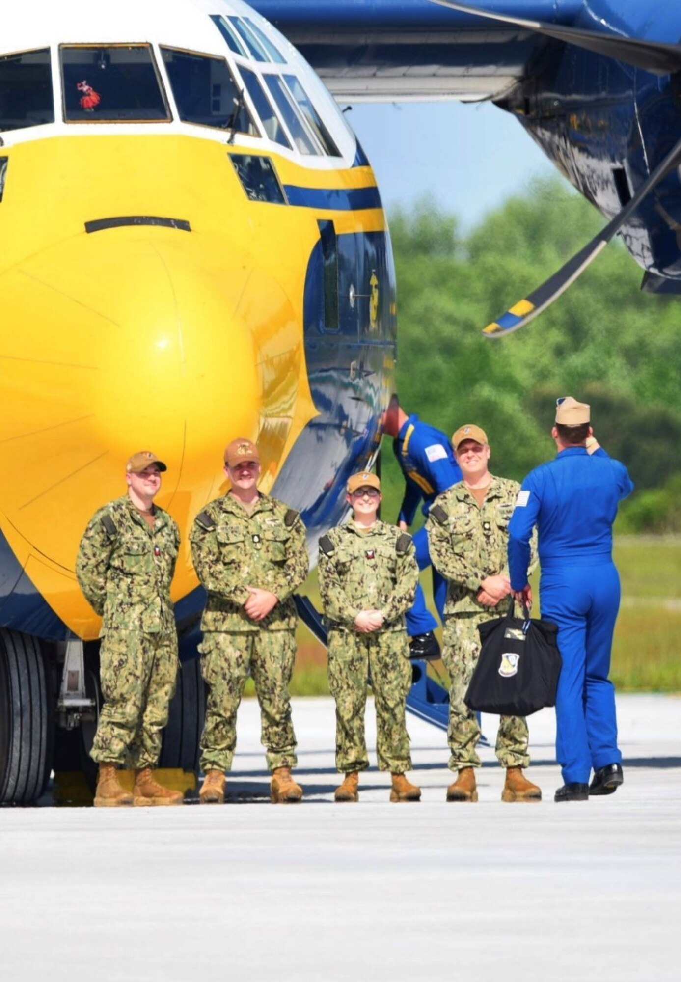 U.S. Navy personnel prepare to board the iconic "Fat Albert" C-130.