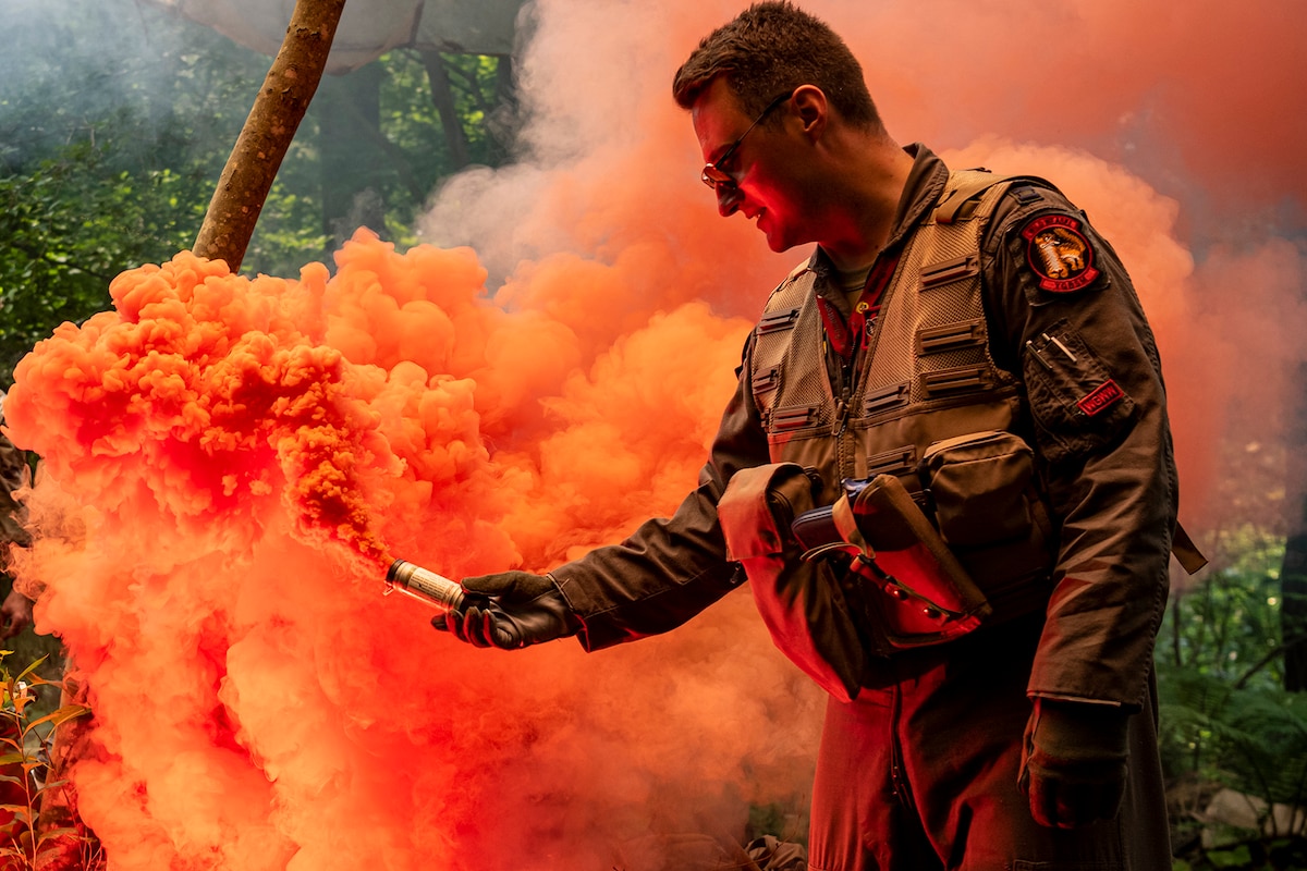 U.S. Air Force Capt. Charles Trader, 13th Fighter Squadron pilot, ignites a flare