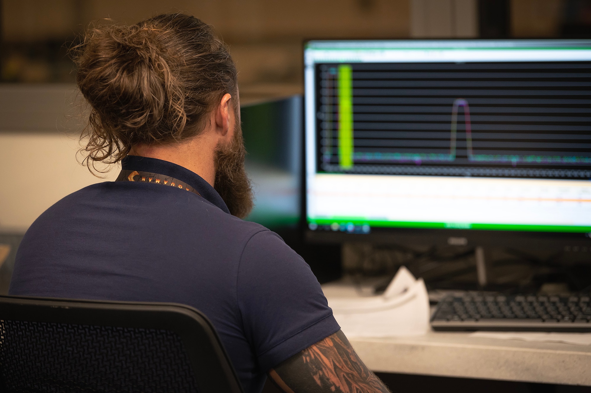A man looks at a computer screen.