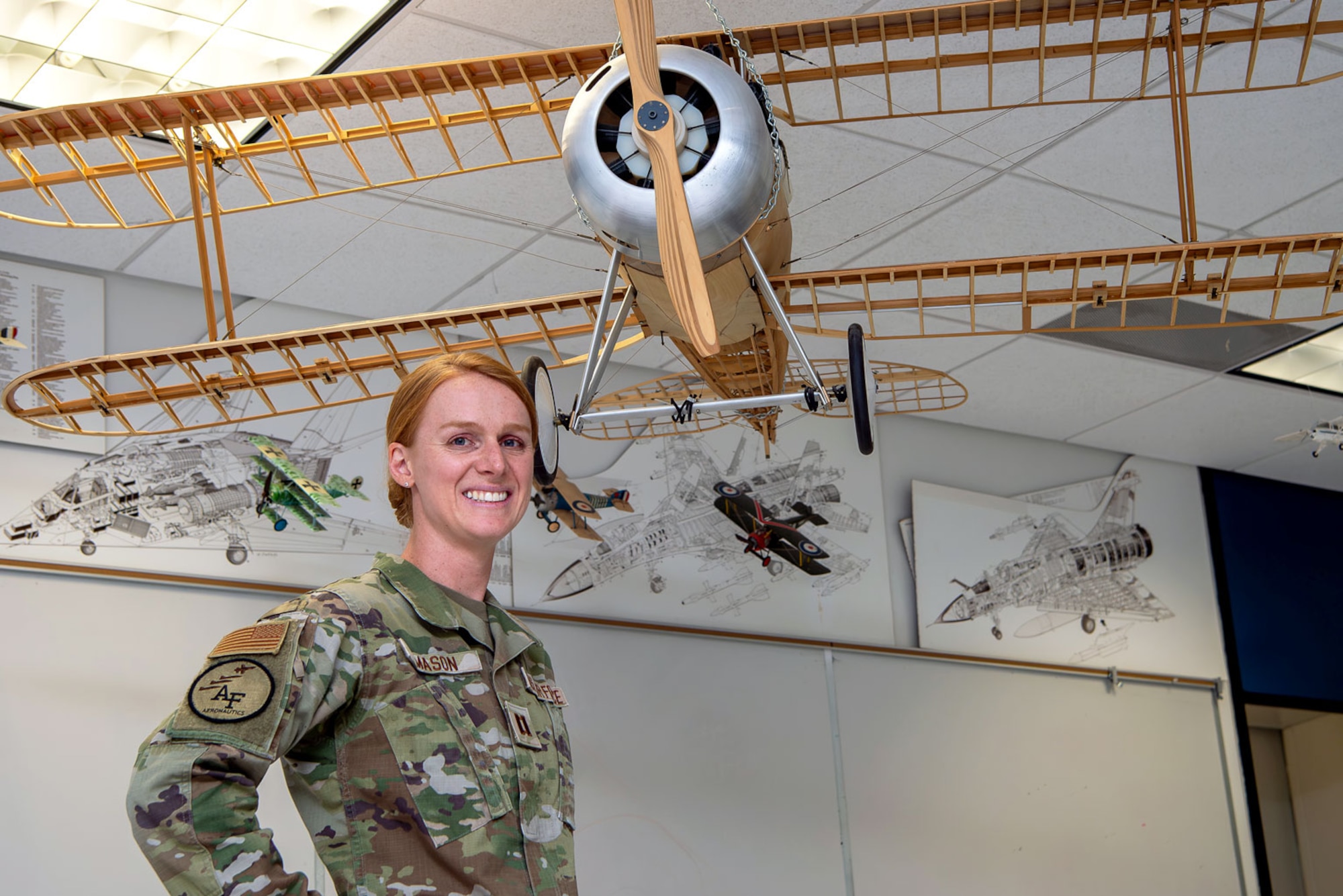 Capt. Anna Mason, U.S. Air Force Academy aeronautics instructor, poses for a photo July 24, 2024, in her classroom at Fairchild Hall, the Academy, Colorado. (U.S. Air Force photo by Justin Pacheco)