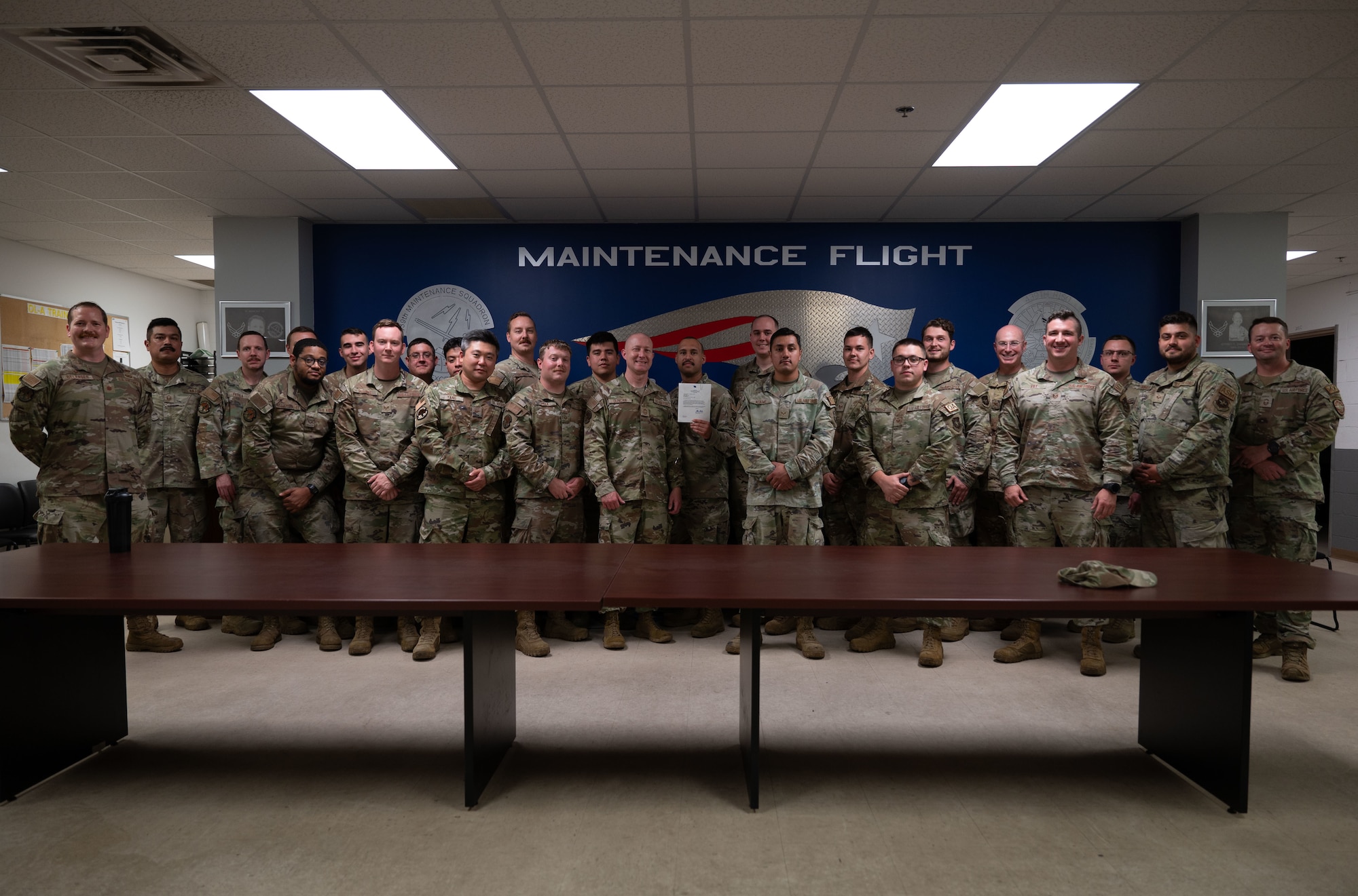 U.S. Airmen from the 439th Maintenance Group and 436th Airlift Wing pose for a photo at Westover Air Reserve Base, Massachusetts, July 31, 2024. Dover AFB leadership visited Westover Air Reserve Base to connect with Airmen, learn about new technologies and conduct an all-call to members of the 436th Maintenance Squadron, Operating Location Alpha, a tenant unit of the 436th AW. (U.S. Air Force photo by Airman Liberty Matthews)