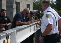 OICC Florence completes final topping out ceremony for fire station construction
