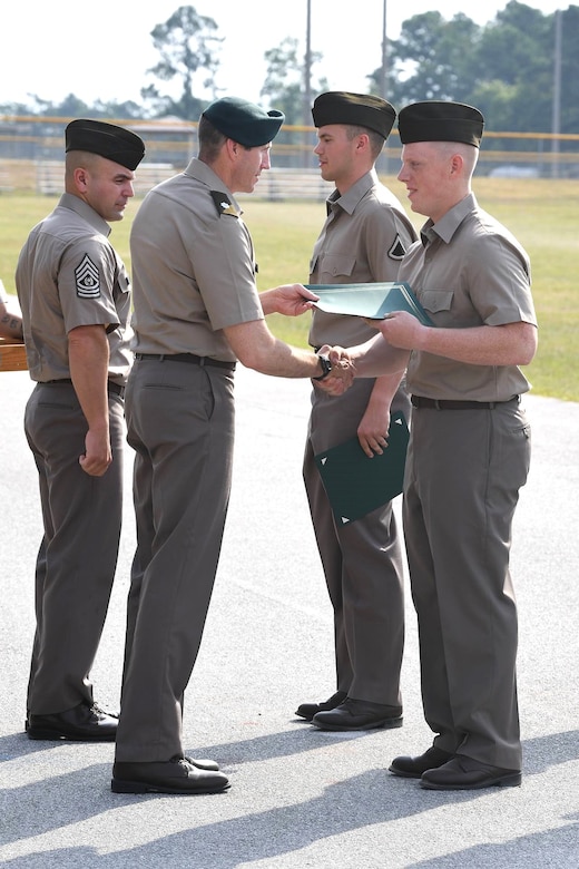 Pvt. Lukas Harris, right, a Pennsylvania Army National Guard recruit, receives the Soldier of the Cycle award at his Basic Combat Training graduation June 27, 2024, at Fort Jackson, South Carolina. (Courtesy photo)