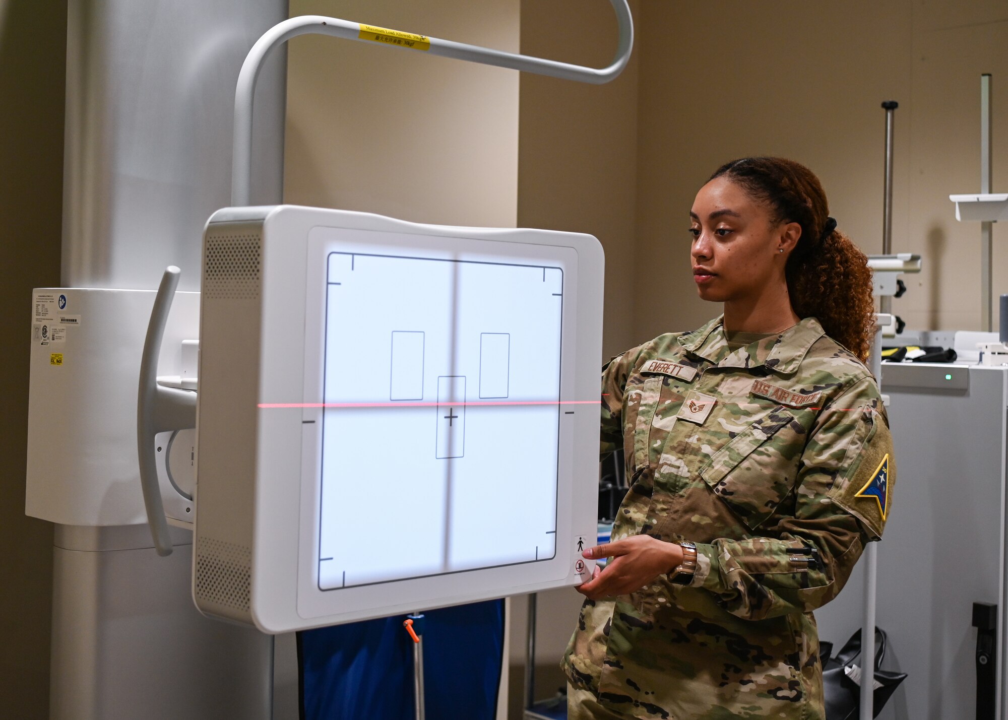 A 30th Medical Group diagnostic imaging technologist and winner of the 2024 Blacks in Government Meritorious Service Award, prepares the X-Ray radiography system for mandatory weekly training at Vandenberg Space Force Base.