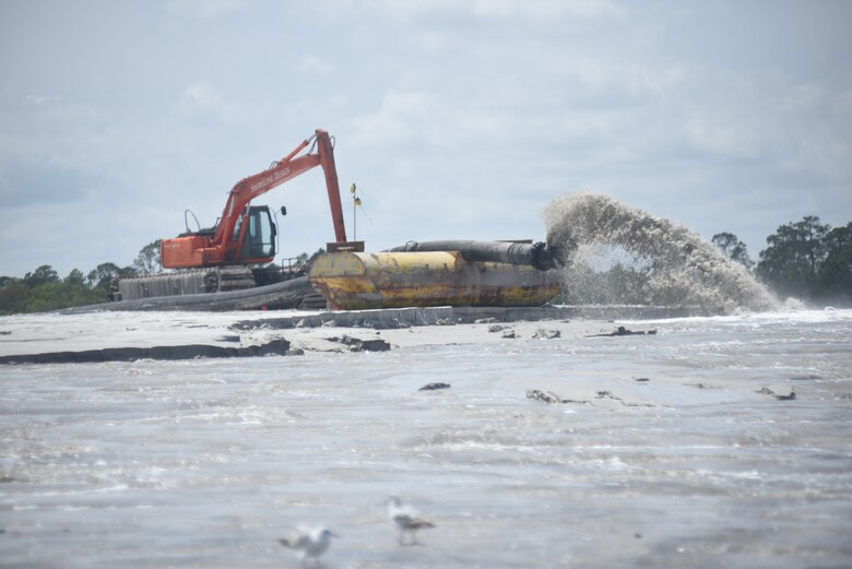 Photo of a dredge depositing dredge material onto a man-made island along the East River, Georgia, April 9, 2024. The island is designed to provide nesting and foraging habitat for a variety of shorebird and seabird species.