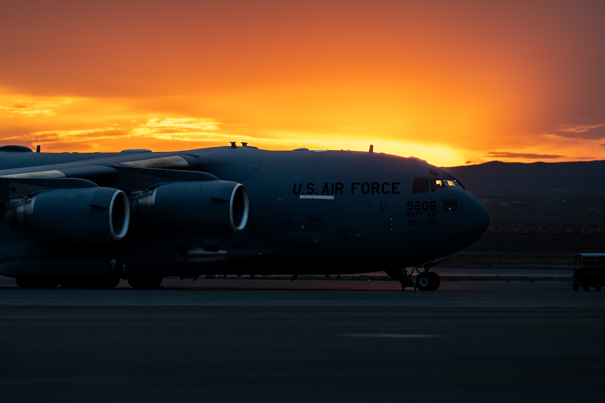 Airmen loading a C-17 Aircraft