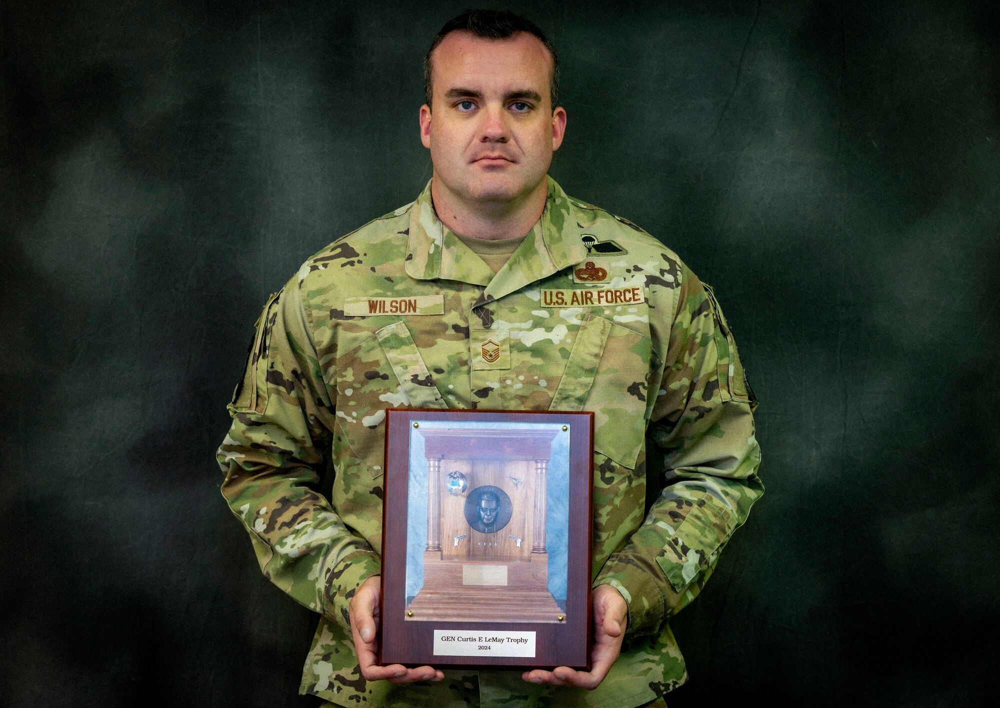 U.S. Air Force Master Sgt. Andrew Wilson, 8th Aircraft Maintenance Unit specialist section chief, displays the General Curtis LeMay Trophy award at Holloman Air Force Base, New Mexico, July 31, 2024. Wilson achieved the highest-scoring Air Force competitor in the National Trophy individual pistol match at Camp Perry, Ohio. (U.S. Air Force photo by Airman 1st Class Michelle Ferrari)