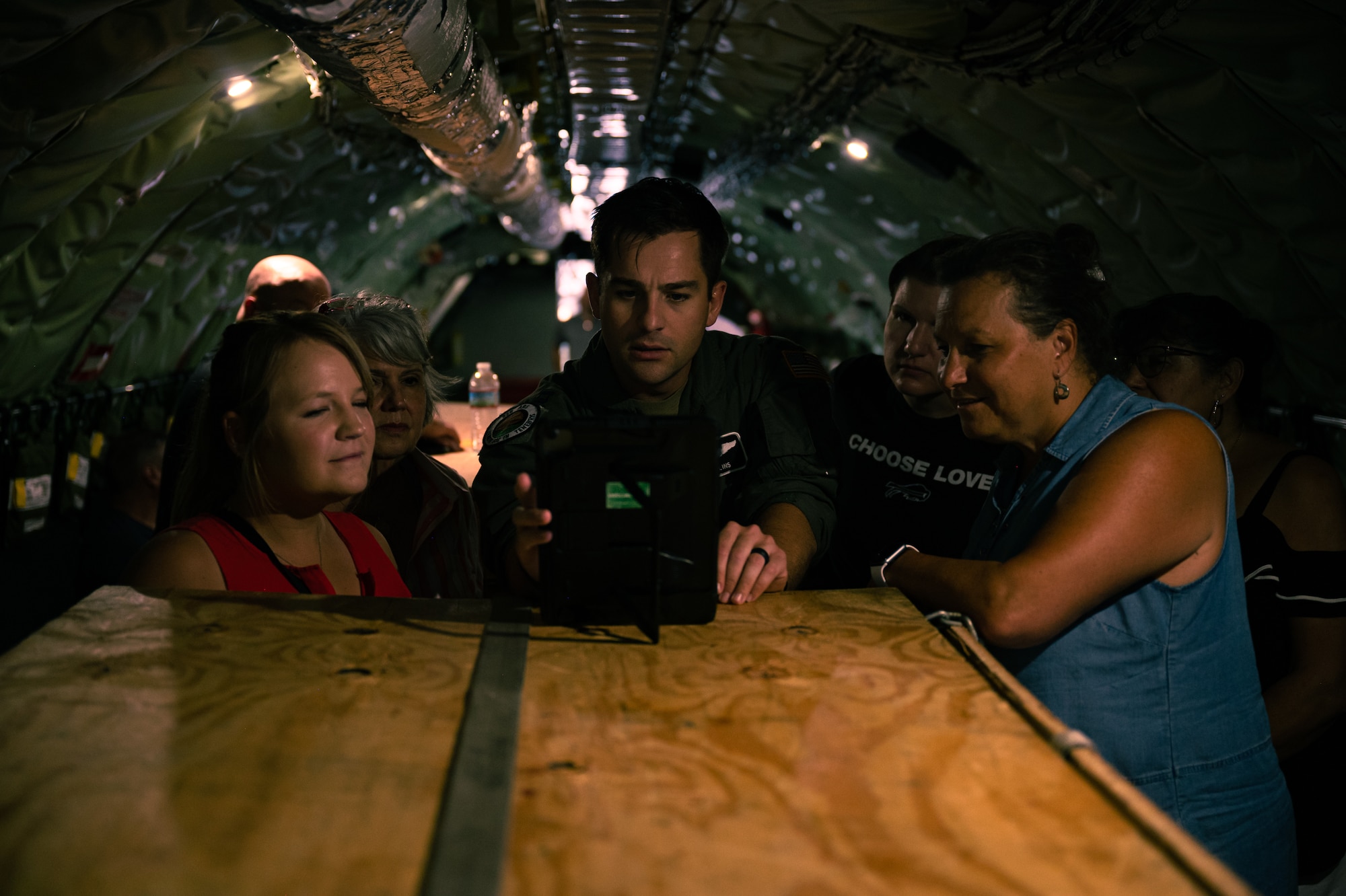 Capt. Kyle Mullins, a Missions Planner with the 328th Air Refueling Squadron, explains to civilian employers of 914th Air Refueling Wing during an Employer Support of the Guard and Reserve "Bosslift" refueling mission somewhere over the Northeastern U.S. August 1, 2024.