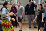 Dance Instructor Kristine Keliiliki demonstrates classical dance movements local to the pacific island regions in a dance therapy class held aboard NSA Bethesda at the National Intrepid Center of Excellence (NiCOE) May 26, 2023. This event was in recognition of Pacific Islander Heritage Month and utilized holistic methods of dance and movement to help participants feel more comfortable in their own bodies.