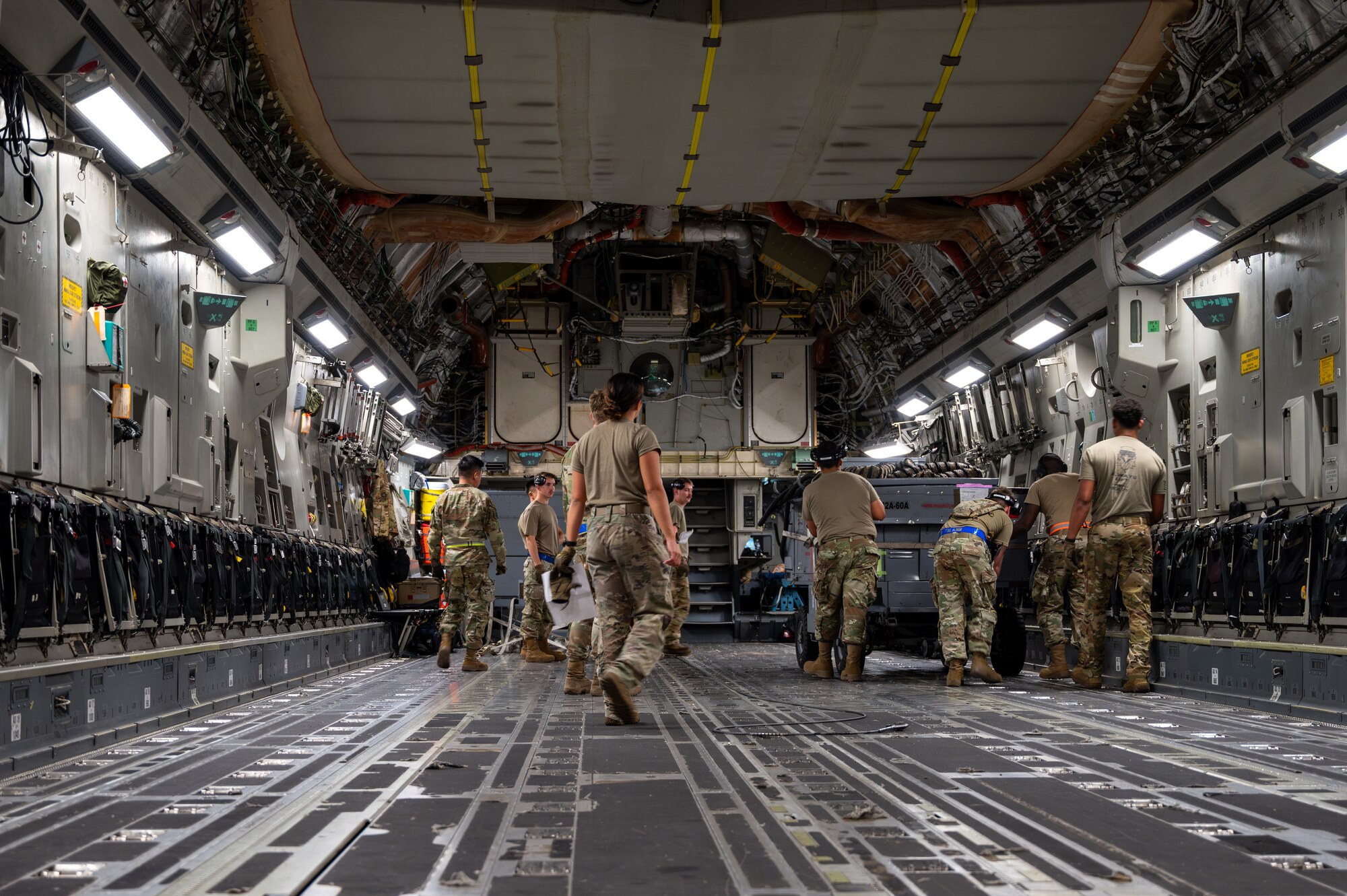 Airmen loading a C-17 Aircraft