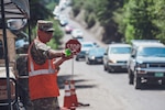 U.S. Army Spc. Nicholas Whitson, 220th Military Police Company, Colorado National Guard, directs traffic on Cottonwood Pass, Colorado,  Aug. 18, 2021. The use of National Guard resources in response to the impacts of the I-70 Glenwood Canyon closure due to recent mud and debris slides was authorized by executive order of Gov. Jared Polis. (U.S. Army National Guard photo by Sgt. Ashley Low)
