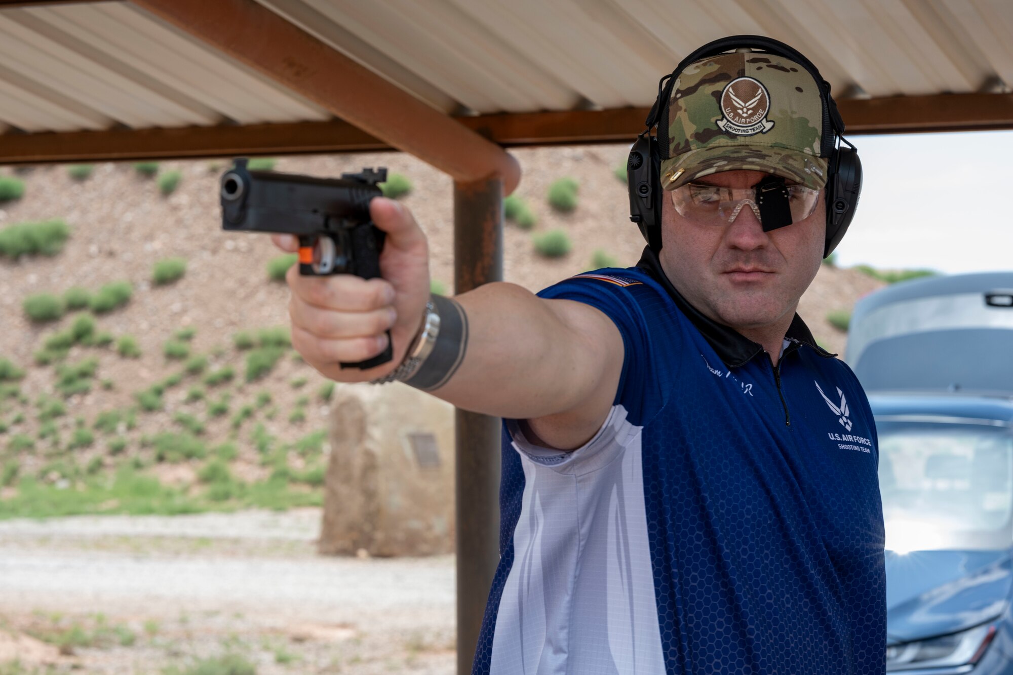 U.S. Air Force Master Sgt. Andrew Wilson, 8th Aircraft Maintenance Unit specialist section chief, prepares to shoot a target at La Luz, New Mexico, July 28, 2024. Wilson practices four to five times weekly to maintain his marksmanship skills and mentors those interested in competitive shooting. (U.S. Air Force photo by Airman 1st Class Michelle Ferrari)