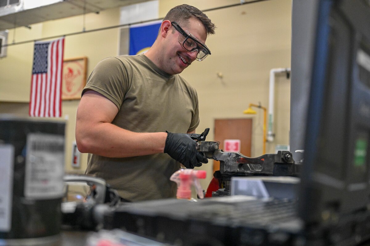A man works in a mechanic shop.