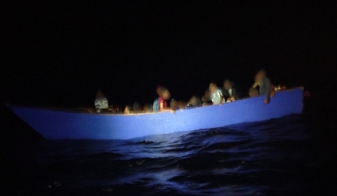 An unlawful maritime migration voyage vessel is interdicted by Coast Guard Cutters Heriberto Hernandez and Richard Dixon and a Station San Juan surface vessel July 29, 2024, in Mona Passage waters west of Rincon, Puerto Rico. The Coast Guard repatriated 52 migrants from this voyage as well as 39 migrants from a separate interdiction to the Dominican Republic Navy.  (Courtesy photo)