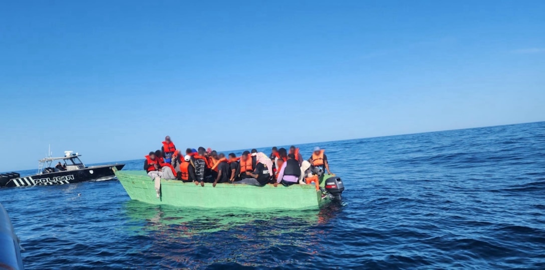 An unlawful maritime migration voyage vessel is interdicted by Customs and Border Protection and Puerto Rico Police Joint Forces of Rapid Action marine units July 31, 2024, just off Cabo Rojo, Puerto Rico.  The Coast Guard repatriated 39 migrants from this voyage as well as 52 migrants from a separate interdiction to the Dominican Republic Navy.  (Courtesy photo)