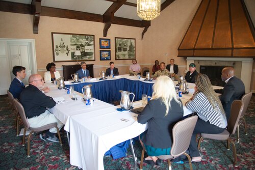 A group of individuals sitting at a table.