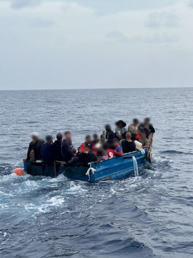 A Coast Guard Cutter Charles David Jr. small boat crew pulls up alongside a Cuban migrant rustic vessel near Marathon, July 29, 2024. Migrants on unlawful maritime migration voyages will be rescued and repatriated to their country of origin or departure.