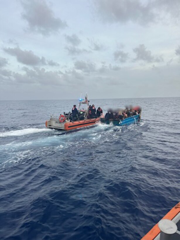 A Coast Guard Cutter Charles David Jr. small boat crew pulls up alongside a Cuban migrant rustic vessel near Marathon, July 29, 2024. Migrants on unlawful maritime migration voyages will be rescued and repatriated to their country of origin or departure.