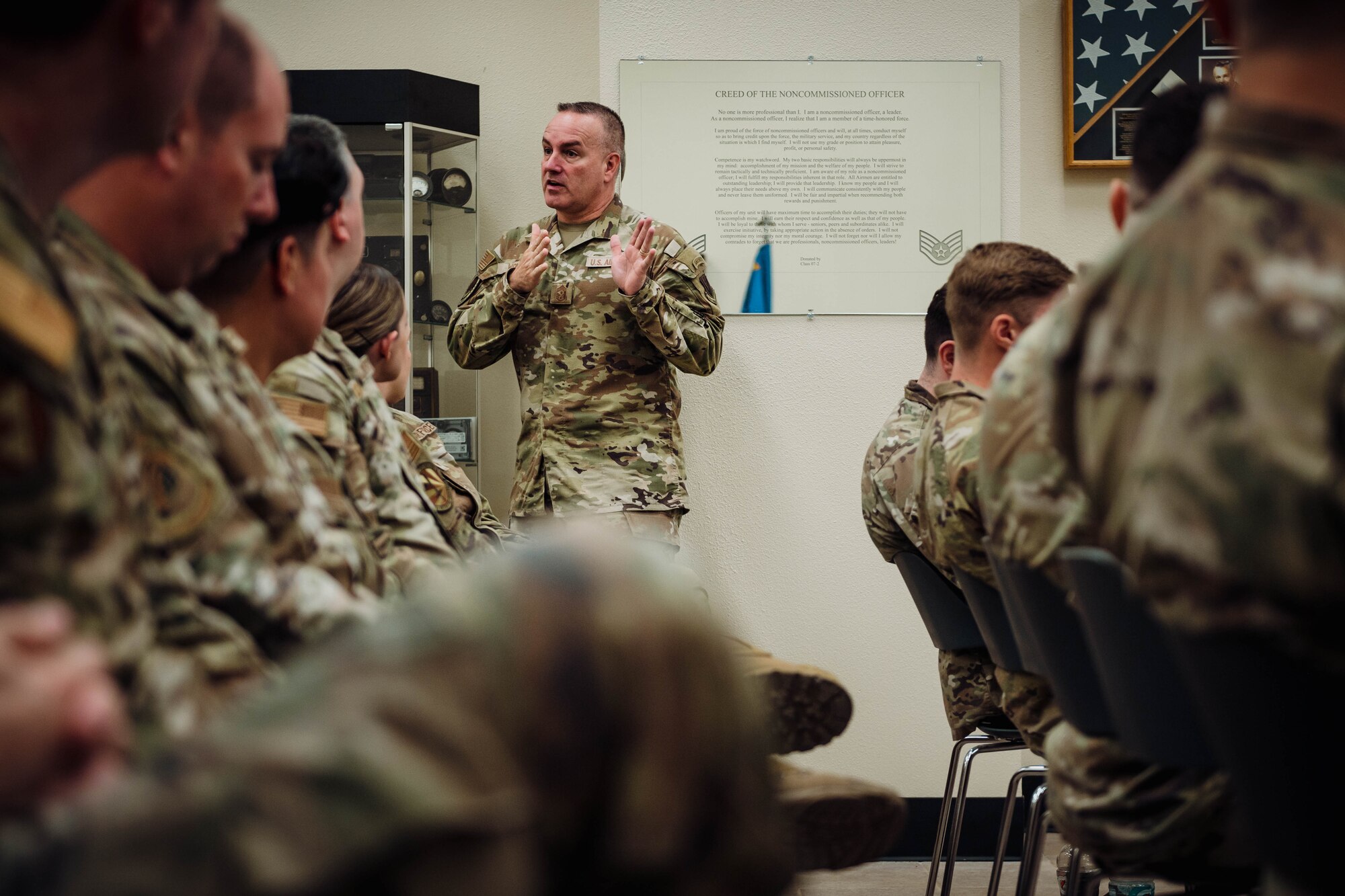 U.S. Air Force Command Chief Master Sgt. Dave Wolfe, Air Combat Command, speaks to Luke Air Force Base senior noncommissioned officer inductees for a professional enhancement seminar, Jul. 26, 2024, at Luke AFB, Arizona. During the seminar, Wolfe provided mentorship on subjects including career progression, leadership skills, and comprehensive Airman fitness.