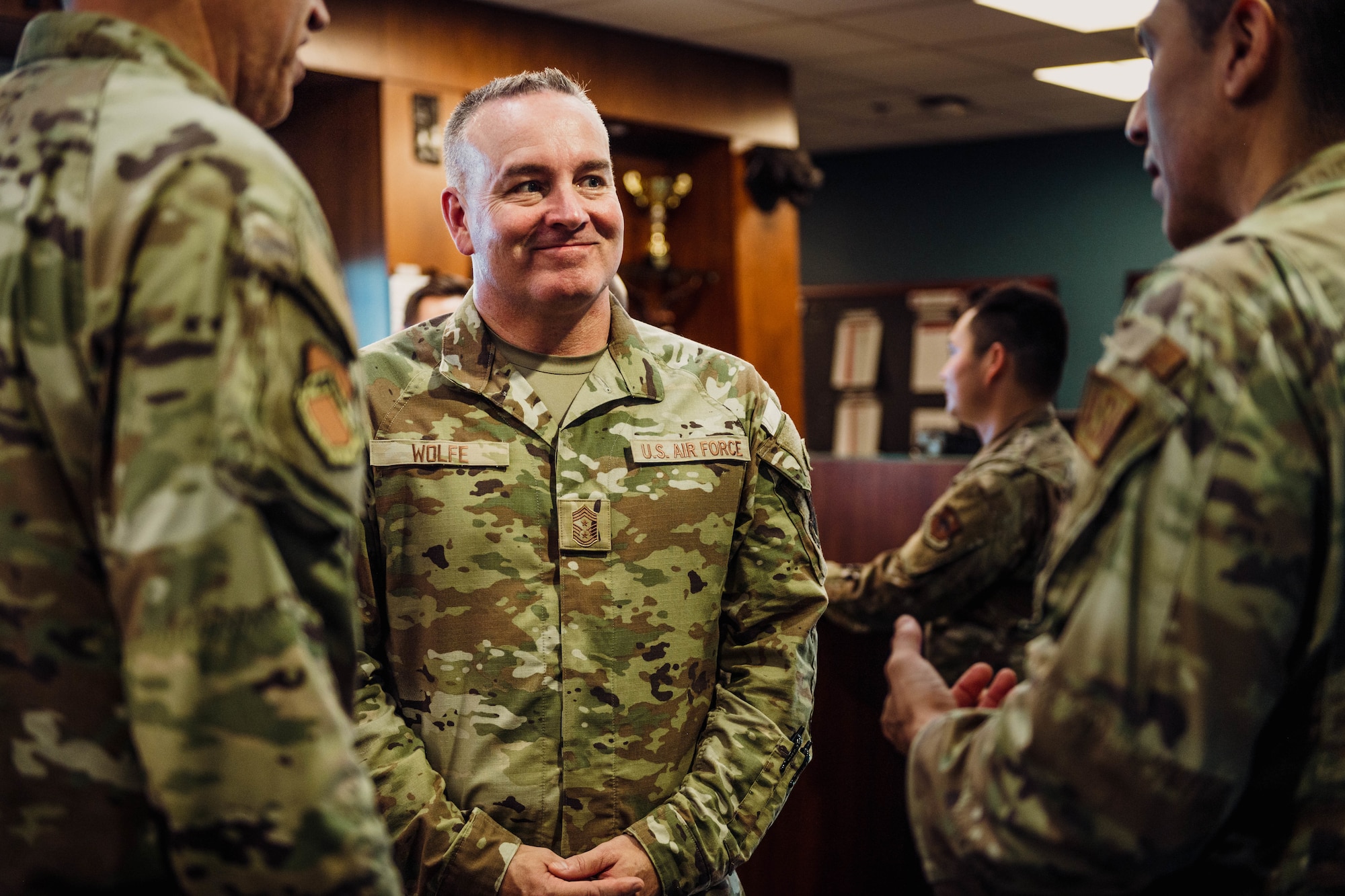 U.S. Air Force Command Chief Master Sgt. Dave Wolfe, Air Combat Command, listens to Luke Air Force Base senior noncommissioned officers from the 63rd Aircraft Maintenance Unit, Jul. 26, 2024, at Luke AFB, Arizona. Wolfe toured the world’s premier fighter wing to gain insight on their mission, on how the world’s greatest fighter pilots and combat-ready Airmen are trained, and sparked dialogue on developing Airmen for the era of Great Power Competition.