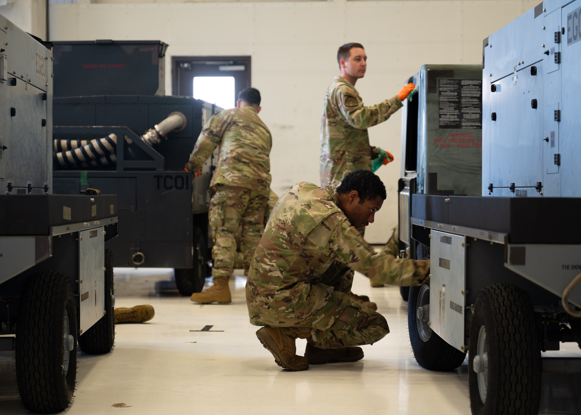 U.S. service members and volunteers prepare and clean equipment for an upcoming agile combat exercise, Operation KENNY’S RETURN, at Joint Base Lewis-McChord, Washington, August 2, 2024. The 62d Airlift Wing will combine with various units to form the 7th Expeditionary Airlift Squadron for the exercise, including Airmen from the 7th Airlift Squadron and the 627th Air Base Group.