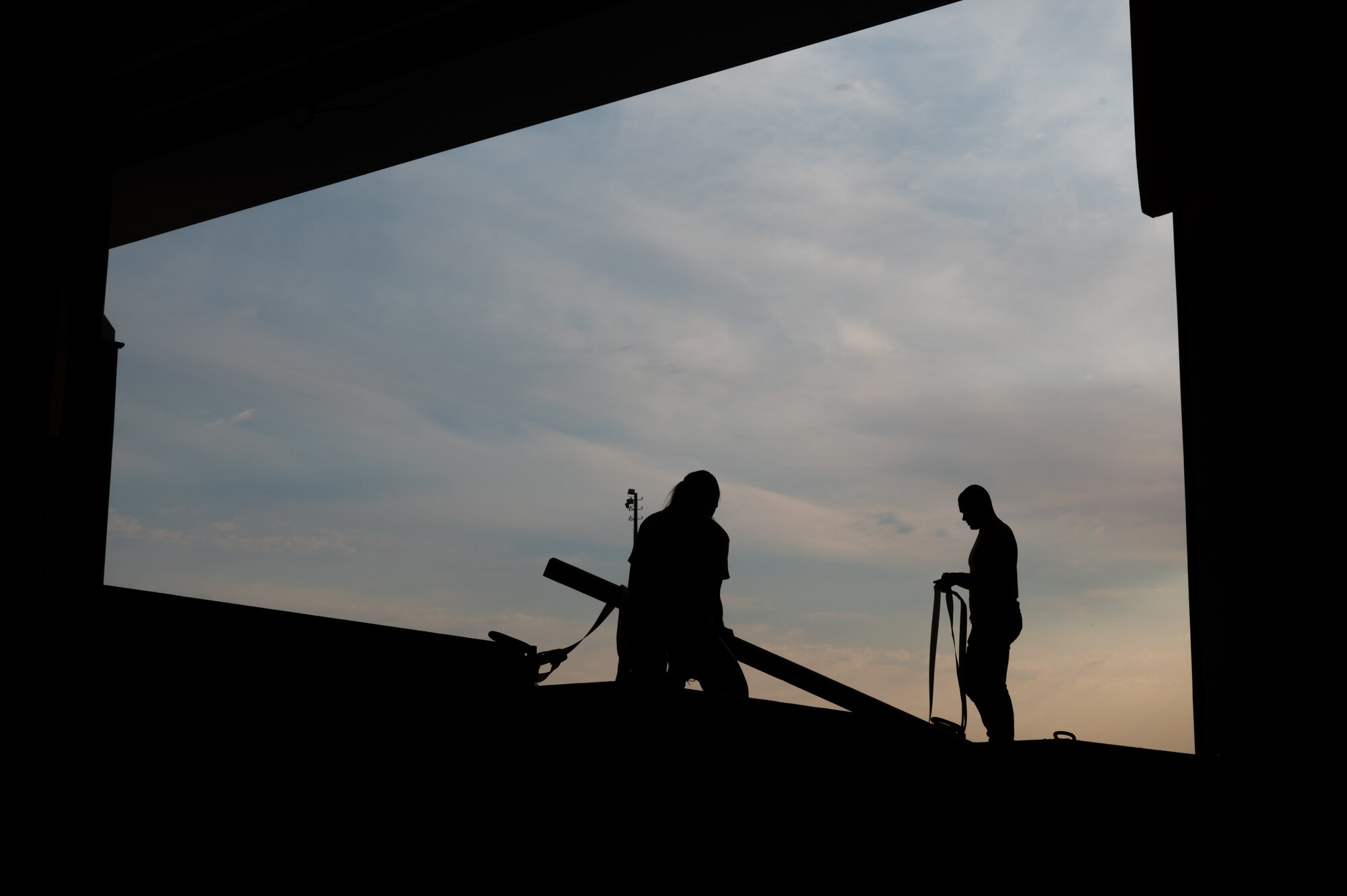 U.S. service members and volunteers prepare and clean equipment for an upcoming agile combat exercise, Operation KENNY’S RETURN, at Joint Base Lewis-McChord, Washington, August 2, 2024. The 62d Airlift Wing will combine with various units to form the 7th Expeditionary Airlift Squadron for the exercise, including Airmen from the 7th Airlift Squadron and the 627th Air Base Group.