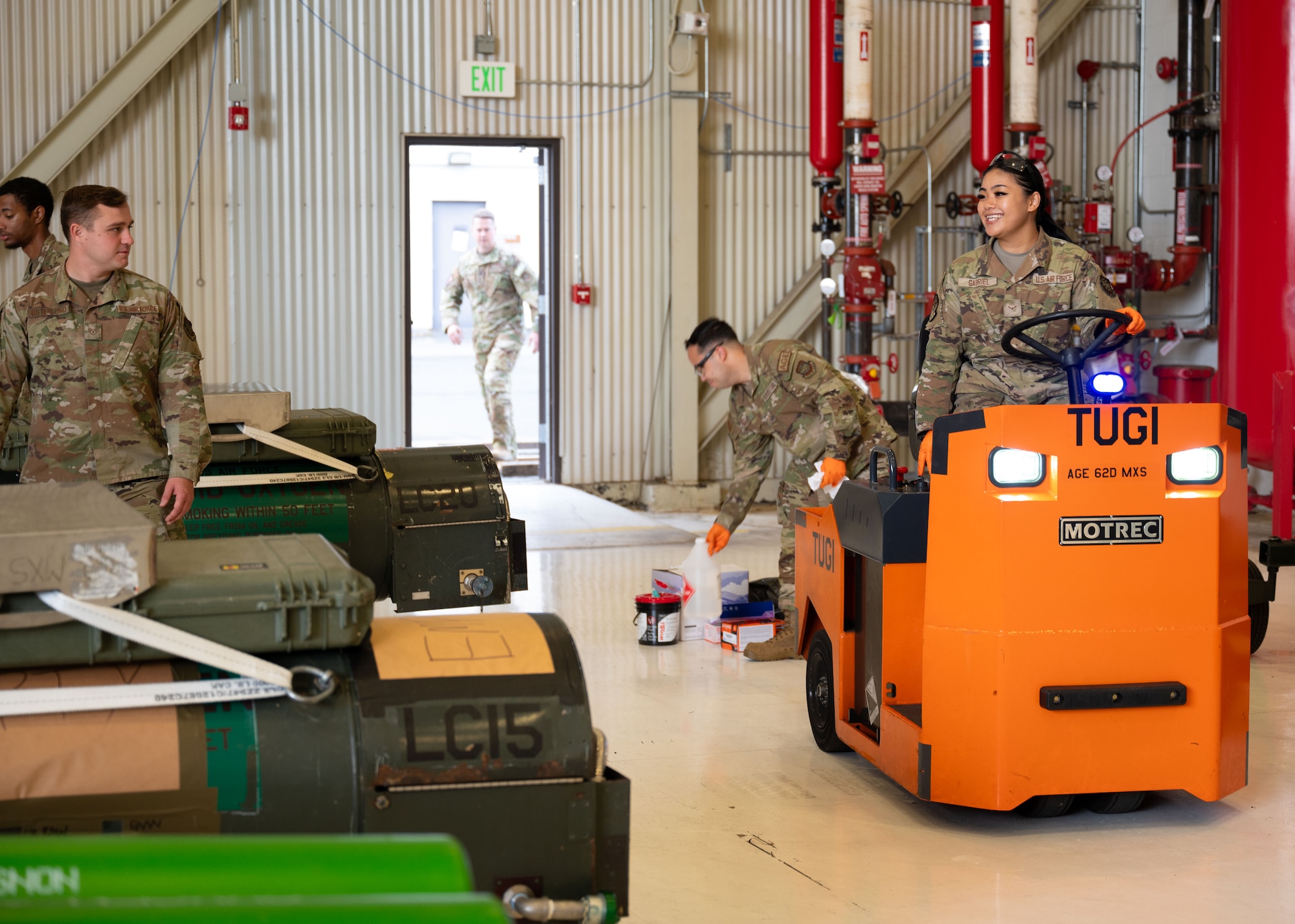 U.S. service members and volunteers prepare and clean equipment for an upcoming agile combat exercise, Operation KENNY’S RETURN, at Joint Base Lewis-McChord, Washington, August 2, 2024. The 62d Airlift Wing will combine with various units to form the 7th Expeditionary Airlift Squadron for the exercise, including Airmen from the 7th Airlift Squadron and the 627th Air Base Group.