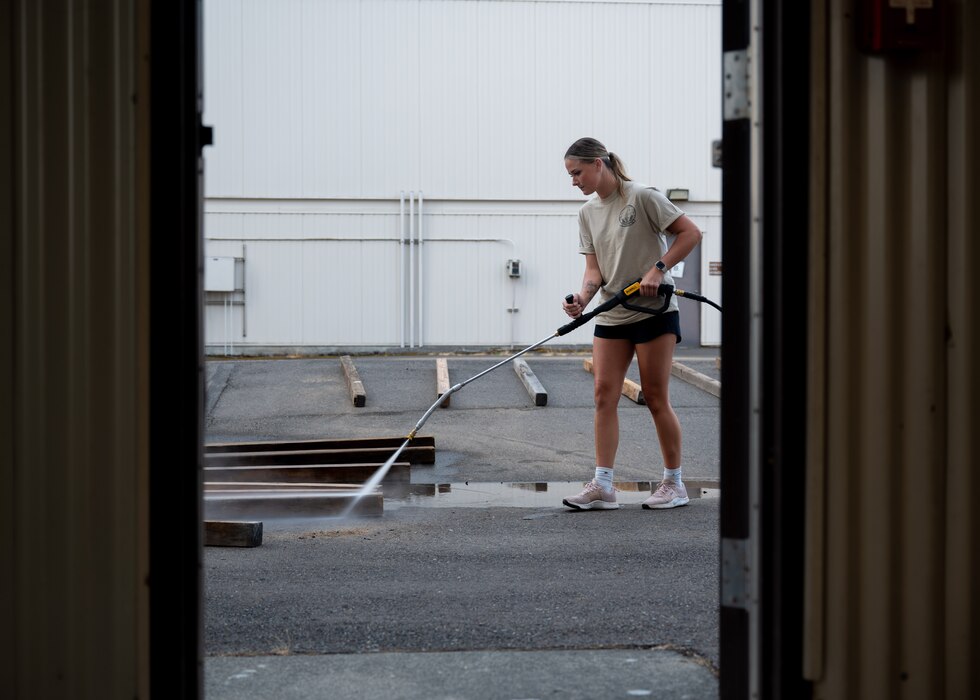 U.S. service members and volunteers prepare and clean equipment for an upcoming agile combat exercise, Operation KENNY’S RETURN, at Joint Base Lewis-McChord, Washington, August 2, 2024. The 62d Airlift Wing will combine with various units to form the 7th Expeditionary Airlift Squadron for the exercise, including Airmen from the 7th Airlift Squadron and the 627th Air Base Group.