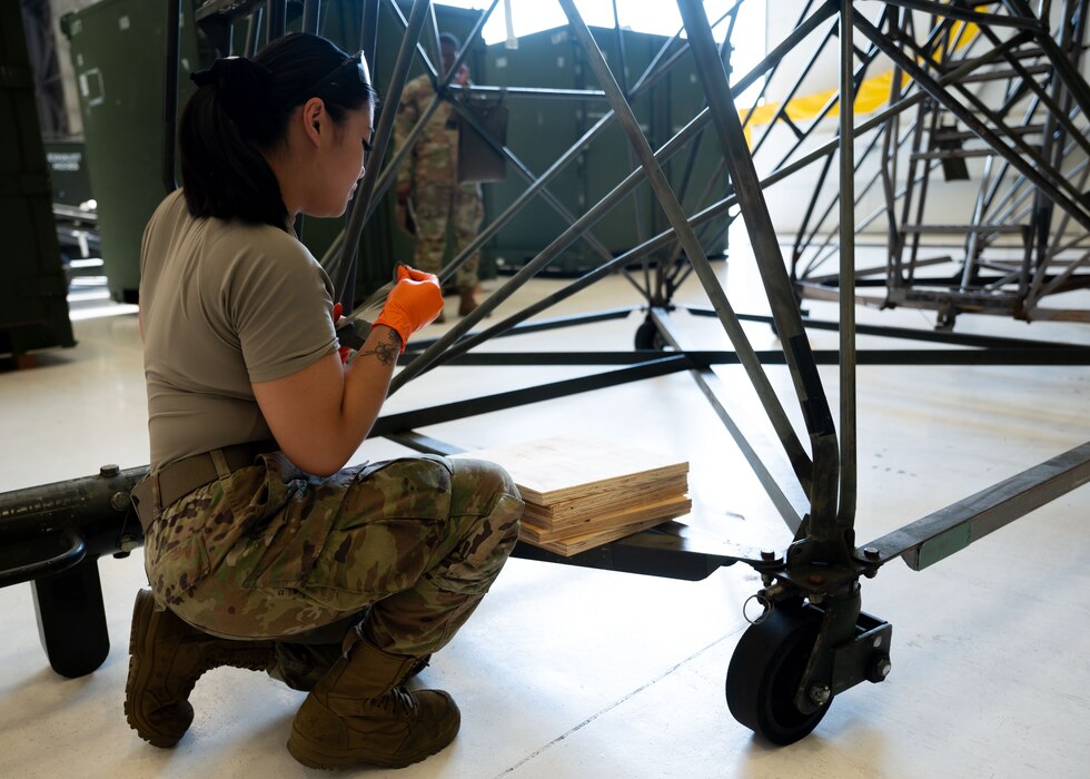 U.S. service members and volunteers prepare and clean equipment for an upcoming agile combat exercise, Operation KENNY’S RETURN, at Joint Base Lewis-McChord, Washington, August 2, 2024. The 62d Airlift Wing will combine with various units to form the 7th Expeditionary Airlift Squadron for the exercise, including Airmen from the 7th Airlift Squadron and the 627th Air Base Group.