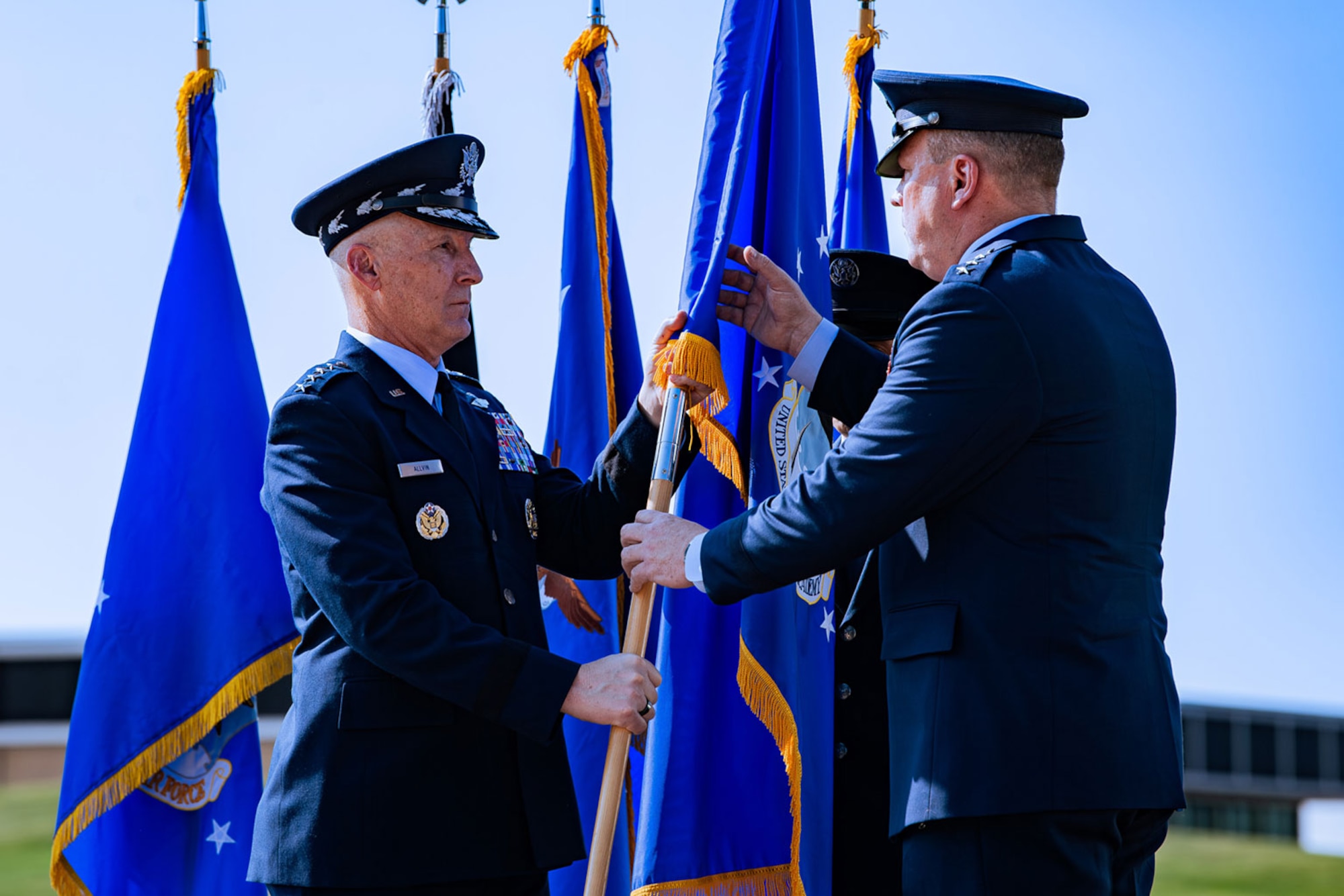 U.S. Air Force Chief of Staff Gen. David Allvin and the U.S. Air Force Academy’s newest Superintendent Lt. Gen. Tony Bauernfeind ceremonially pass the unit flag during an assumption of command ceremony held at the Academy, Colo., Aug. 2, 2024.  Bauernfeind became the 22nd Academy superintendent following the retirement of Lt. Gen. Richard M. Clark June 1, 2024. (U.S. Air Force photo by Dylan Smith)