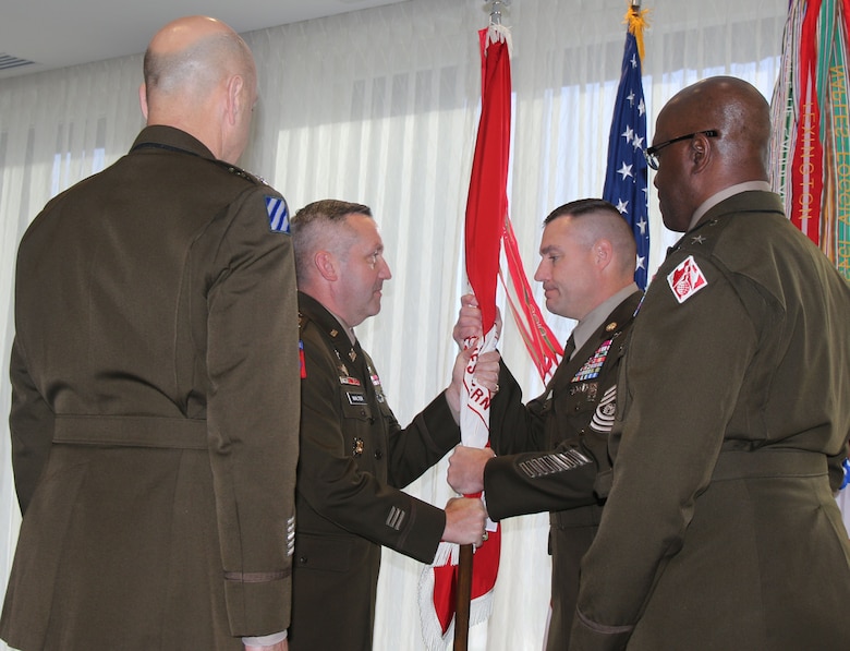 Colonel George H. Walter (center left), incoming commander for the U.S. Army Corps of Engineers, Southwestern Division, hands the Division colors to USACE Command Sergeant Major Douglas Galick (center right), during a change of command ceremony Aug. 2, 2024 at the Westin Downtown Dallas. Walter took command of the Division from Brig. Gen. Kenneth N. Reed (right) in a ceremony officiated by Lt. Gen. Scott A. Spellmon (left), 55th Chief of Engineers and Commanding General, U.S. Army Corps of Engineers.