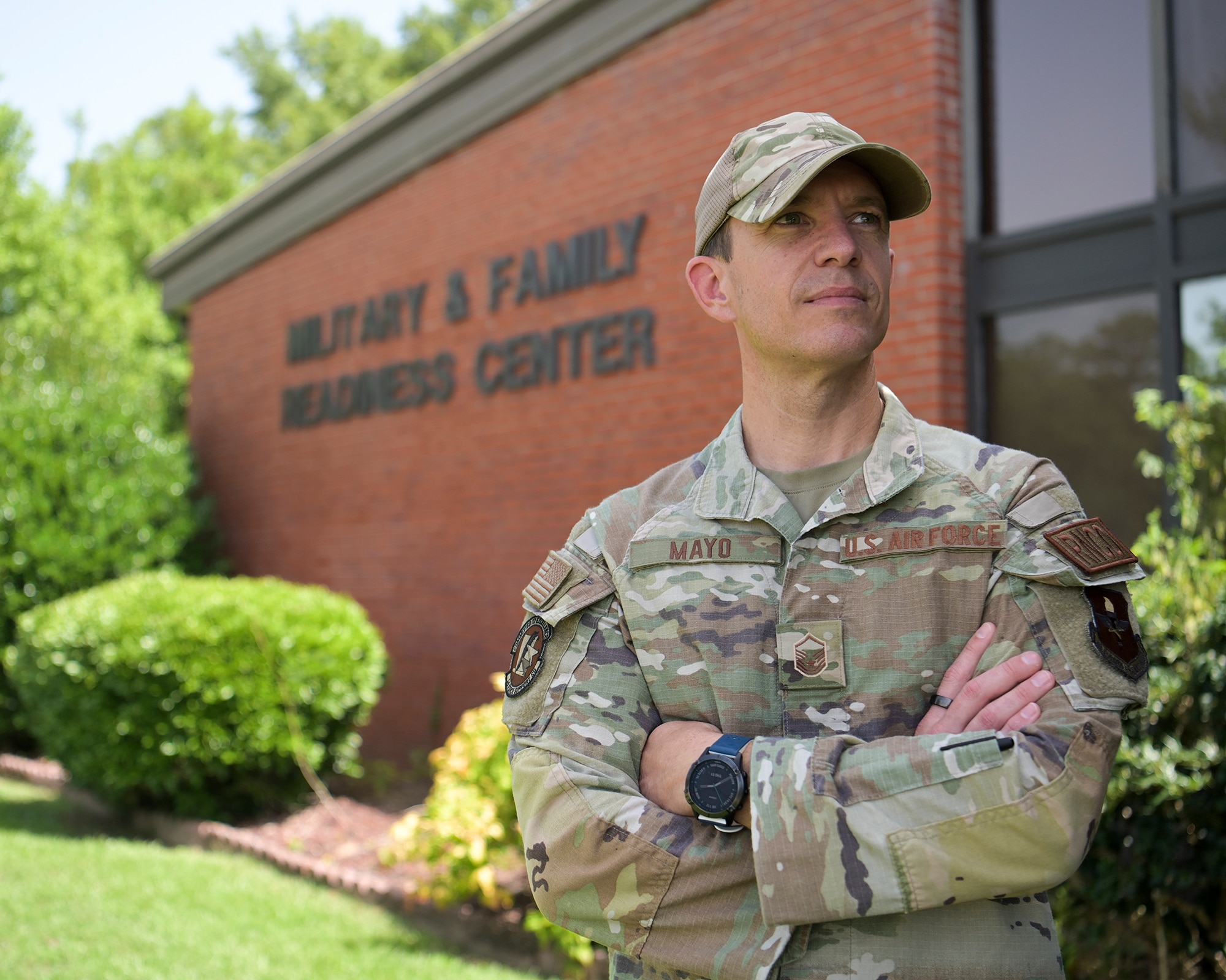 Master Sergeant Matthew Mayo, 14 FSS Military & Family Readiness Center Readiness NCO poses for a feature photo in front of the MFRC building.