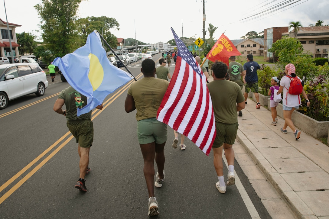 U.S. Marines with Combat Logistics Battalion 13, Combat Logistics Regiment 17, 1st Marine Logistics Group, participate in a 5K run and walk in support of anti-human trafficking awareness on World Day Against Trafficking in Persons during exercise Koa Moana 24 at Koror, Palau, July 30, 2024. During Koa Moana’s deployment throughout the Indo-Pacific region, U.S. Marines and Sailors from I Marine Expeditionary Force work to strengthen alliances and partnerships with development of interoperable capabilities, combined operations, theater security cooperation, and capacity-building efforts. (U.S. Marine Corps photo by Sgt. Nello Miele)
