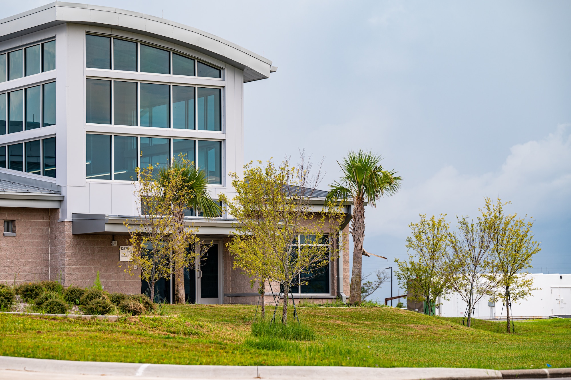 Palm trees stand outside a firestation