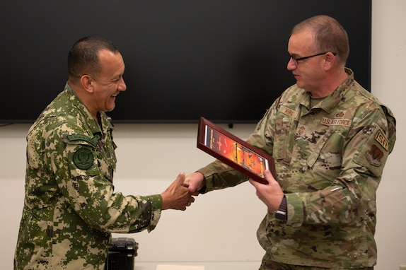 Paraguayan military shakes hands with U.S. Air Force military member.