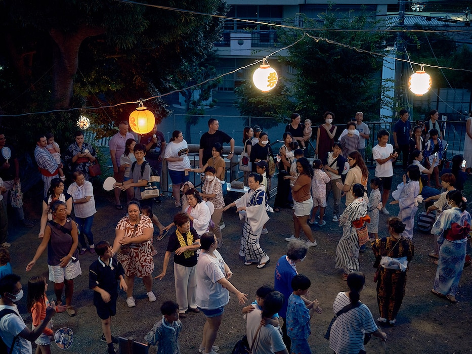 Commander, Fleet Activities Yokosuka community members participate in a Bon Odori at Ikego Shinmeisha Shrine across the street from Ikego Heights Family Housing August 3, 2024 in Zushi, Japan.